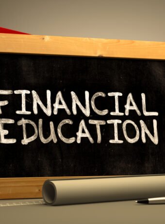 Financial Education Handwritten by white Chalk on a Blackboard.