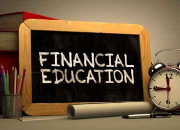 Financial Education Handwritten by white Chalk on a Blackboard.